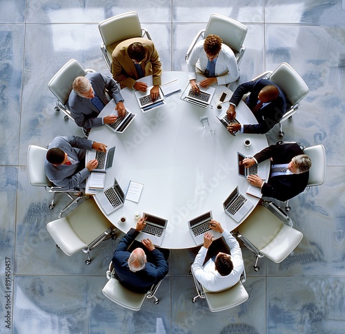 a group of men sitting around a round table