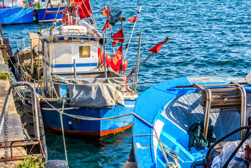 Wallpaper Mural Tranquil harbor scene with a group of colorful docked boats, gently bobbing on the calm water. Torontodigital.ca
