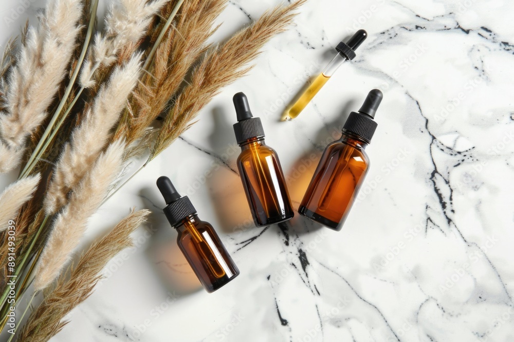 perfume bottle on a white marble background with pampas grass perfume bottle on a white marble background with pampas grass