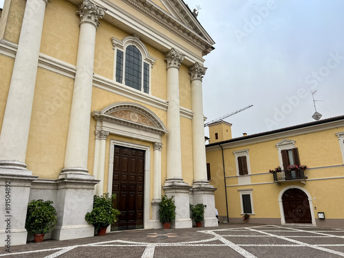 Old medieval cathedral in summer day. Beautiful italian church. Pontevico. Church of Saints Thomas and Andrew the Apostles. Abbey of Pontevico Brescia Italy. Chiesa dei Santi Tommaso e Andrea Apostoli photo