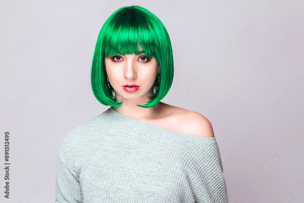 Woman with Green Hair and Sweater. Young Caucasian woman with short green hair, wearing an off-shoulder sweater and a neutral expression. Horizontal photo Woman with Green Hair and Sweater. Young Caucasian woman with short green hair, wearing an off-shoulder sweater and a neutral expression. Horizontal photo