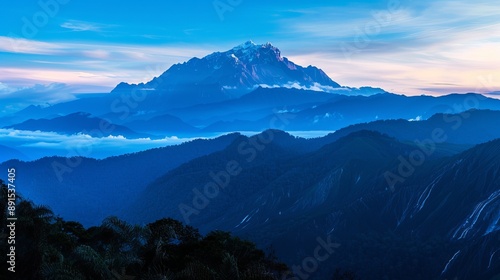 The stunning blue hue of Mount Kinabalu at sunrise. photo