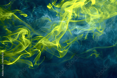 Dynamic Yellow and Blue Smoke Swirls Against Dark Blue Background