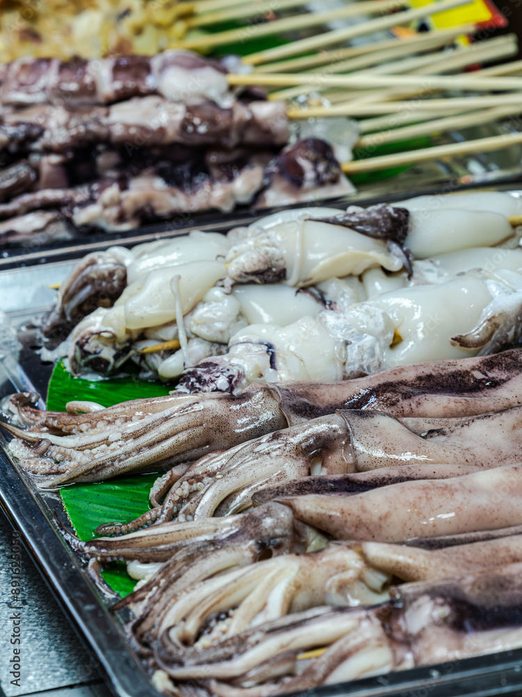 Fresh Squid Skewers at a Market Stall Fresh Squid Skewers at a Market Stall