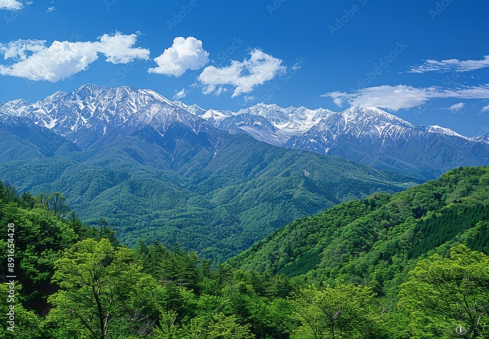 mountain range from an angle, clear blue sky, distant snow-capped mountains in background mountain range from an angle, clear blue sky, distant snow-capped mountains in background