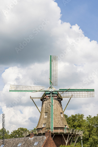 Floor windmill in the center of village Norg in Municipality Noordenveld in the Netherlands. Traditional Esdorp in Northern Drenthe. photo