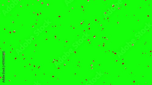 Falling Red foil Confetti on Green Background