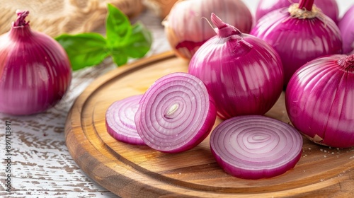 Fresh Red Onions on Wooden Board