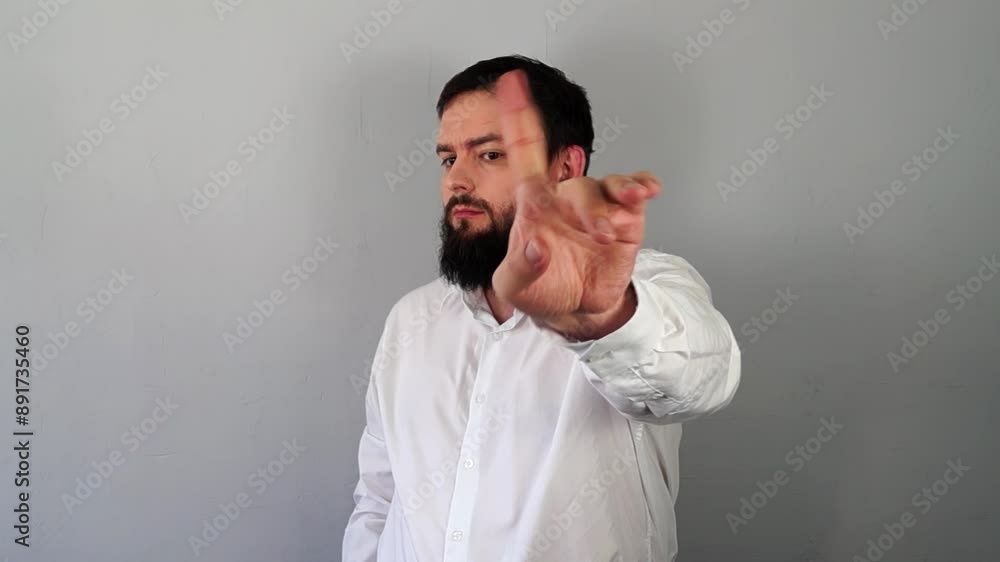 Stop hand sign. Serious angry young man showing stop sign palm gesture refusing, saying No, stop finger sign, enough. Rejection of bad habits concept Stop hand sign. Serious angry young man showing stop sign palm gesture refusing, saying No, stop finger sign, enough. Rejection of bad habits concept