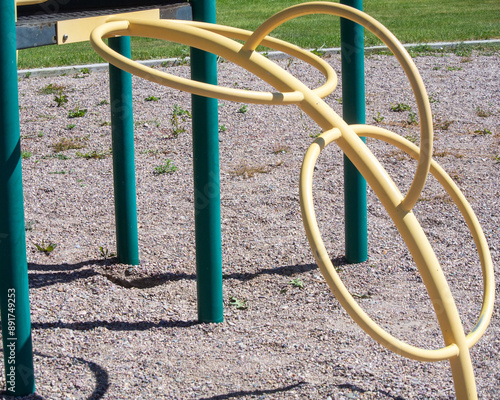 Interesting circle based climbing structure on park playground set