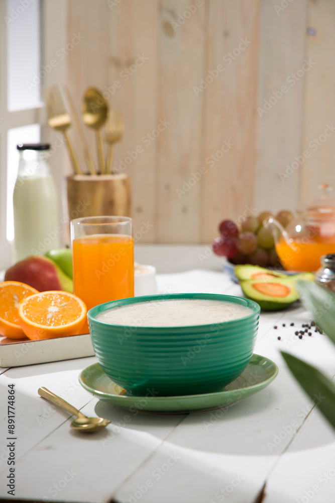Oatmeal, healthy food item arranged on wooden background in a ceramic bowl. Oatmeal, healthy food item arranged on wooden background in a ceramic bowl.