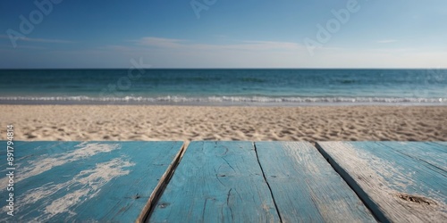 Wood table top on blurred blue sea and white sand beach background. photo