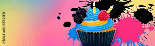 colorful cupcake decorated with candle, blackberry and raspberry against background with abstract splashes of black pink and blue paint. greeting, party concept, birthday cupcake with burning candle photo