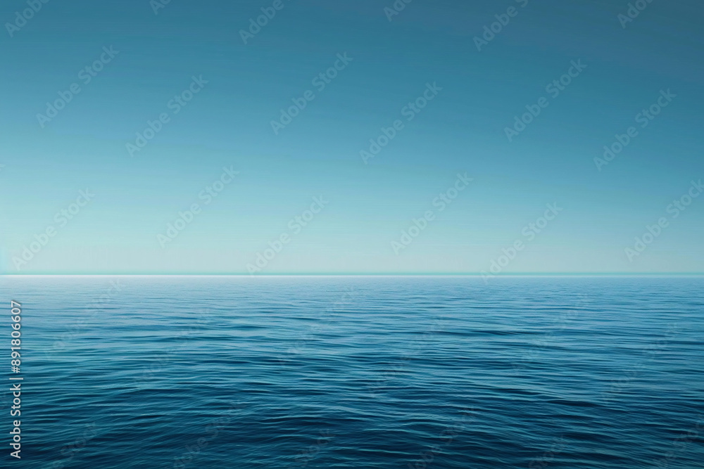 A vast, calm ocean with a clear blue sky meeting at the horizon A vast, calm ocean with a clear blue sky meeting at the horizon