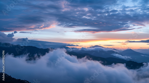 Wallpaper Mural Mountaintop Sunset: A breathtaking view of a mountain range bathed in the golden hues of a setting sun, with clouds swirling below, evokes a sense of peace, tranquility, and boundless possibility.  Torontodigital.ca