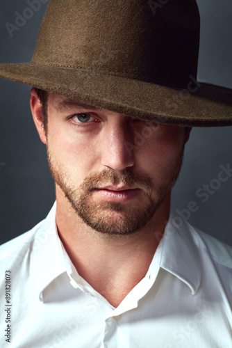 Portrait, serious and man in studio, bodyguard and professional for government, special agent and hat. Grey background, proud and employee of service for protection in agency for safety in Chicago