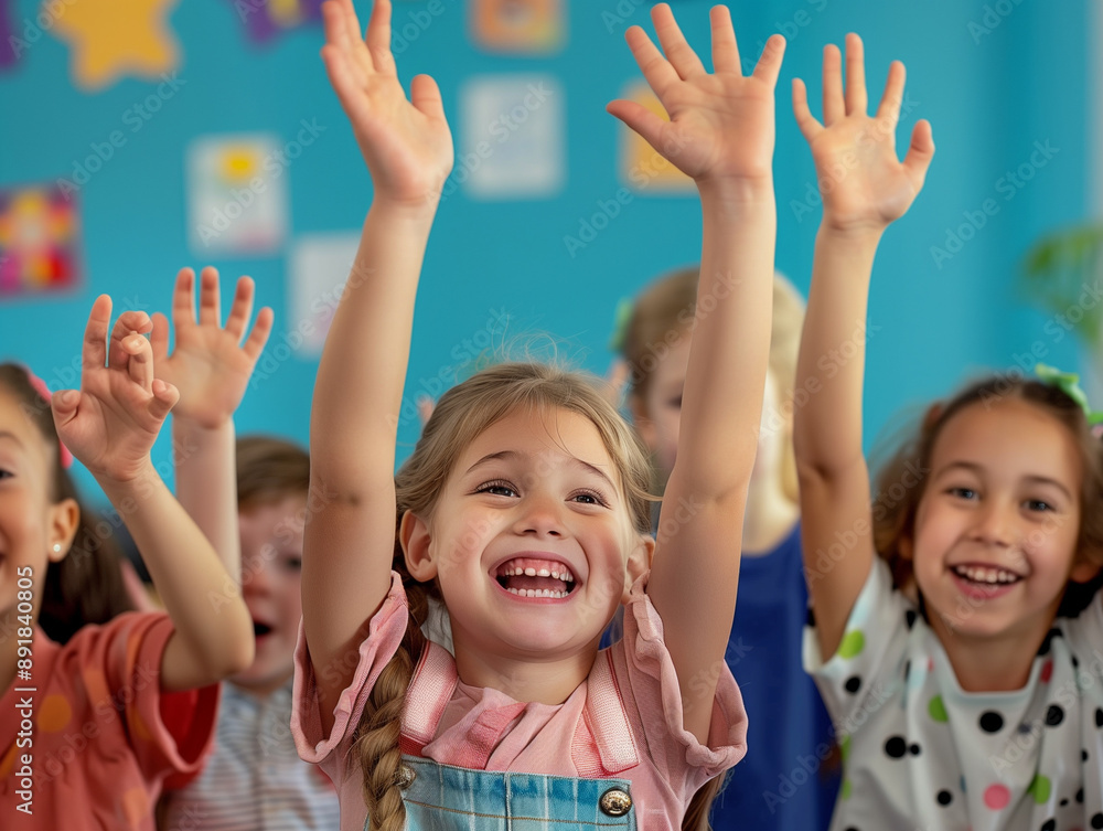Children raise their hands to answer in the classroom Children raise their hands to answer in the classroom