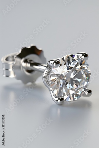 A high-resolution photograph of a single diamond stud earring, brilliant and luxurious, close-up view.