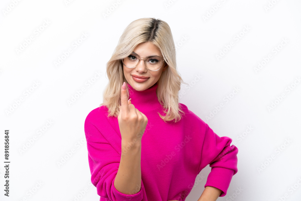 Young Russian woman isolated on white background doing coming gesture Young Russian woman isolated on white background doing coming gesture