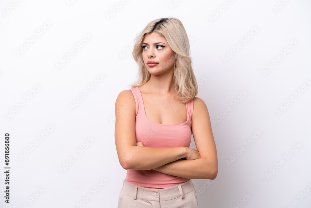Young Russian woman isolated on white background keeping the arms crossed Young Russian woman isolated on white background keeping the arms crossed
