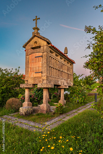 Horreo located in Medal or Insuiña Island, one of the tourist attractions of the small island of A Rabaleira, Pontevedra, Galicia. photo