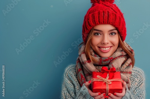 Woman Holding Gifts in Winter Scarf