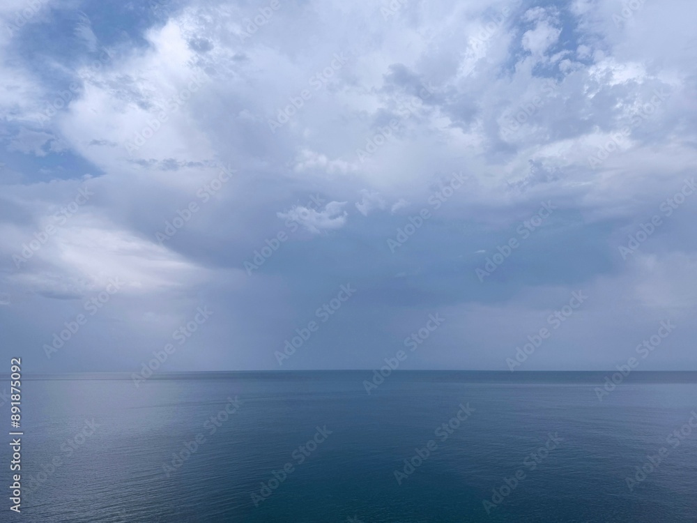 Fototapeta premium Blue ocean and cloudy sky at morning.
