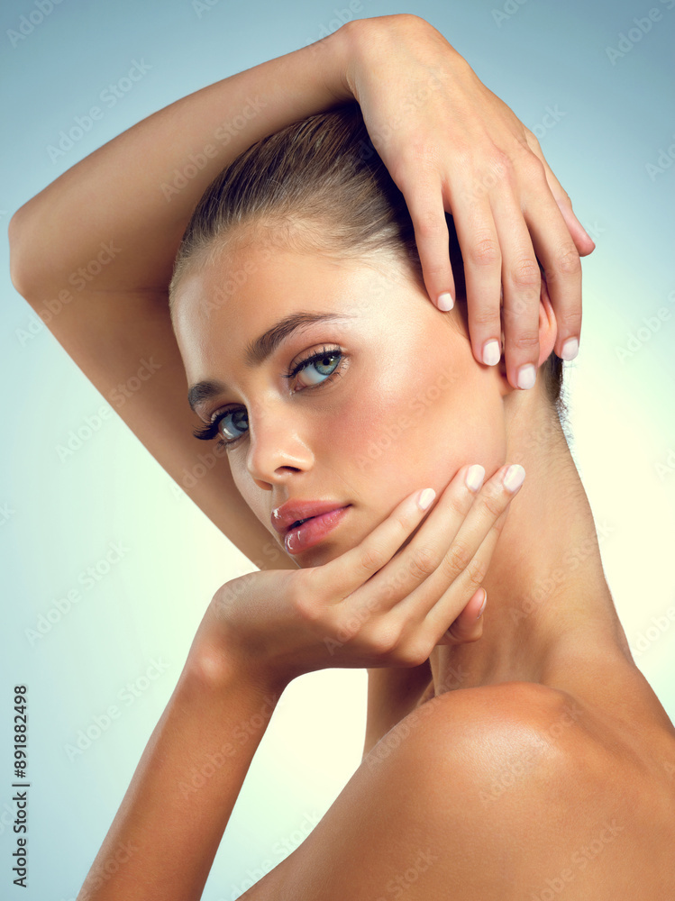 Naklejka premium Studio, pose and portrait of woman for skincare, healthy skin and wellness for transformation with pride. Girl, benefits and results with cosmetics for beauty treatment, serious and blue background