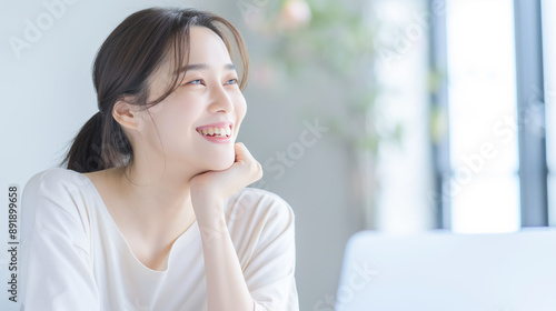 Cheerful Woman Working on Laptop - High-Quality Portrait Featuring Smiling Female in Cozy Home Setting, Remote Work, and Relaxed Atmosphere, Positive and Productive Moment