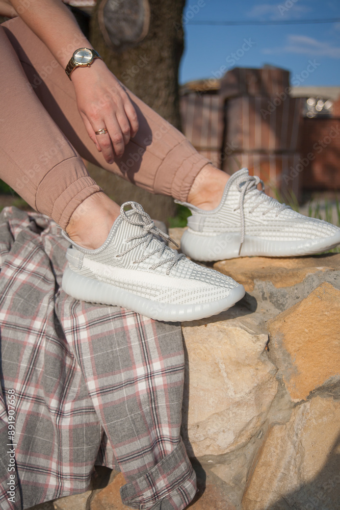 Sports women's shoes on their feet, sporty lifestyle. Sports women's shoes on their feet, sporty lifestyle.