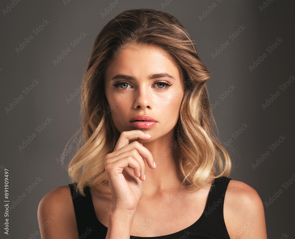 Hair care, portrait and girl in studio with glamour for keratin treatment, shampoo or cosmetics on gray background. Salon, beauty and female model for natural glow, confidence or healthy texture Hair care, portrait and girl in studio with glamour for keratin treatment, shampoo or cosmetics on gray background. Salon, beauty and female model for natural glow, confidence or healthy texture