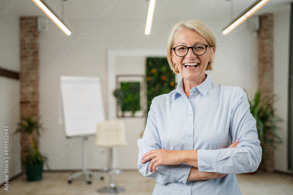 Portrait of one mature blonde caucasian woman with eyeglasses indoor Portrait of one mature blonde caucasian woman with eyeglasses indoor