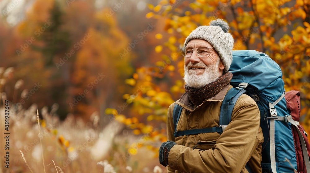 An elderly man, dressed in warm hiking attire and carrying a backpack, smiles contentedly while hiking through a colorful autumn landscape, representing joy and adventure. An elderly man, dressed in warm hiking attire and carrying a backpack, smiles contentedly while hiking through a colorful autumn landscape, representing joy and adventure.