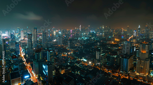 Wallpaper Mural Panoramic view of Bangkok's bustling business district at night, illustrating the cityscape illuminated with lights and skyscrapers, portraying urban vibrancy and economic activity. Torontodigital.ca
