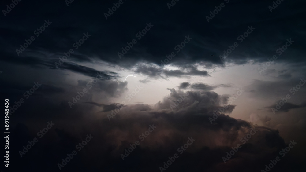 Dark clouds lightened by lightening at summer night. Dark clouds lightened by lightening at summer night.