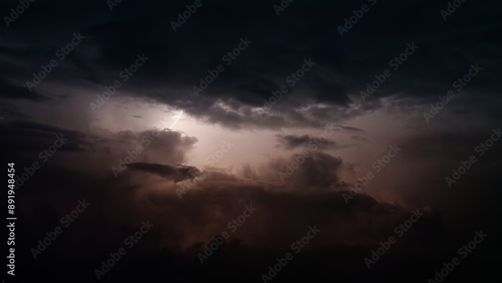 Dark clouds lightened by lightening at summer night. Dark clouds lightened by lightening at summer night.
