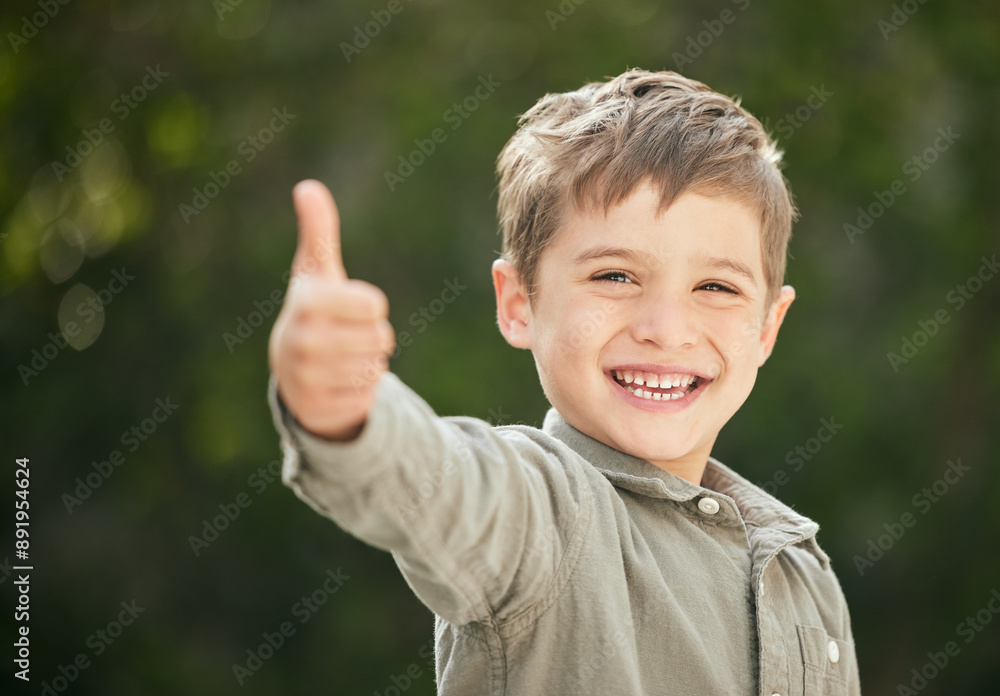 Young boy, happy and thumbs up outdoor for fun, playing and agreement in green backyard with game. Male child, portrait and thank you sign in garden for childhood, development and holiday with smile Young boy, happy and thumbs up outdoor for fun, playing and agreement in green backyard with game. Male child, portrait and thank you sign in garden for childhood, development and holiday with smile