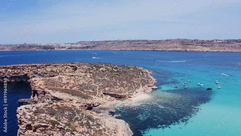 Beautiful white sand beach on Uninhabited Cominotto island, Comino, Malta. Aerial shot. High quality photo Beautiful white sand beach on Uninhabited Cominotto island, Comino, Malta. Aerial shot. High quality photo