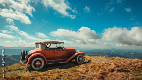 red vintage car on hill with blue sky background