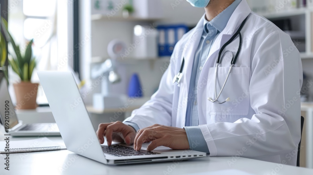 Doctor in office using laptop, modern healthcare technology, digital medical solutions, rear view Doctor in office using laptop, modern healthcare technology, digital medical solutions, rear view