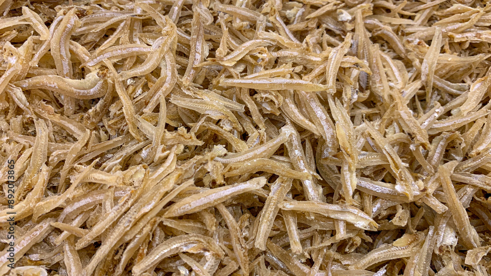 Top view of anchovies displayed in supermarket. Dry seafood concept. Top view of anchovies displayed in supermarket. Dry seafood concept.