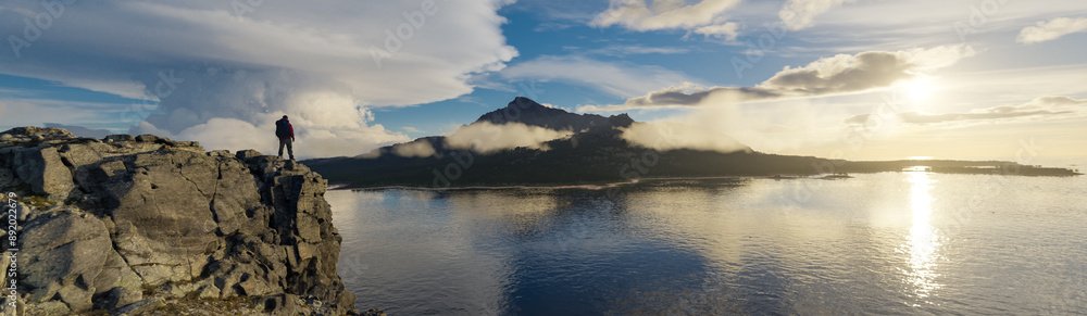 Adventure Man standing on cliff looking on island by ocean. 3d rendering Adventure Man standing on cliff looking on island by ocean. 3d rendering