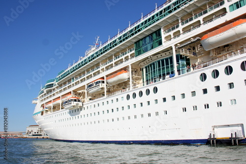 A large cruise ship stands at the pier.
