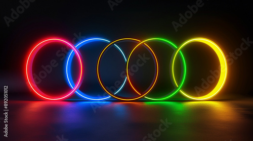 Five colorful neon rings against a dark background, representing unity and celebration.