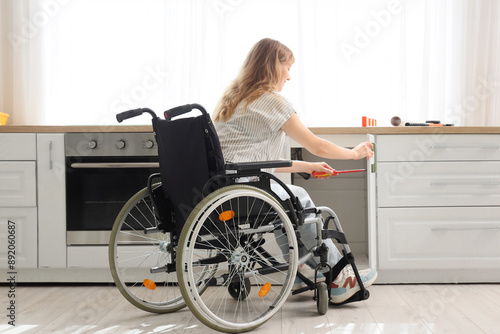 Young woman in wheelchair r...