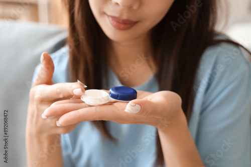 Obraz na plátně Young woman with contact lenses at home, closeup