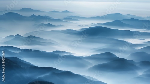 Soft blue-gray mist enveloping a distant mountain range.
