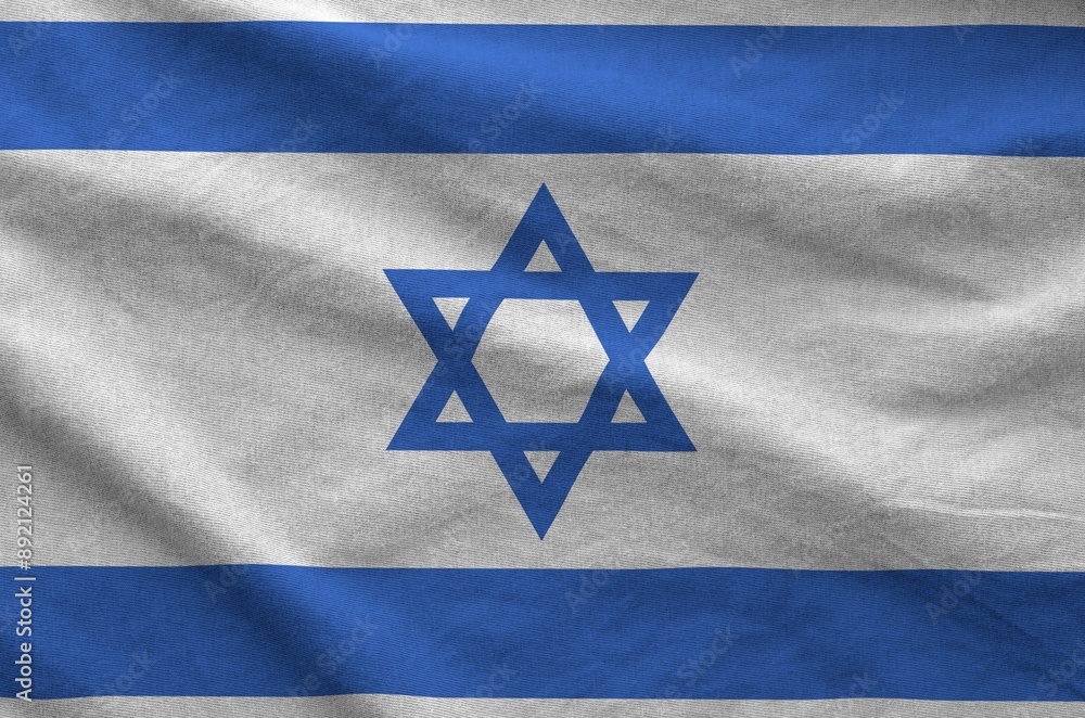 Israel flag depicted on folded wavy fabric of old cloth close up Israel flag depicted on folded wavy fabric of old cloth close up