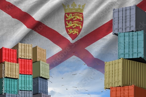 Jersey flag and big stack of shipping cargo containers in docks with sky background close up photo