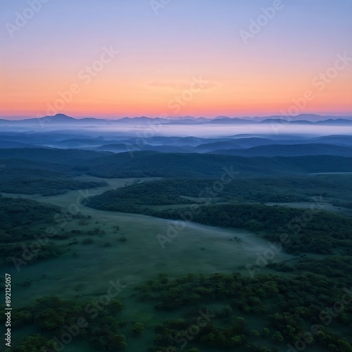Mountain range behind a jungle in the evening.